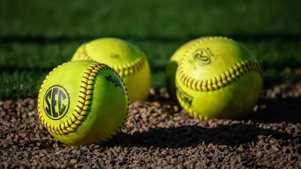 Three softballs laying in the dirt (April 27, 2026)