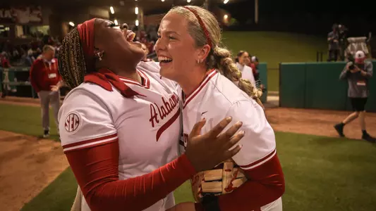 Vic Moten (00) and Brooke Wells (15) laugh together postgame vs. South Carolina (April 30, 2026)
