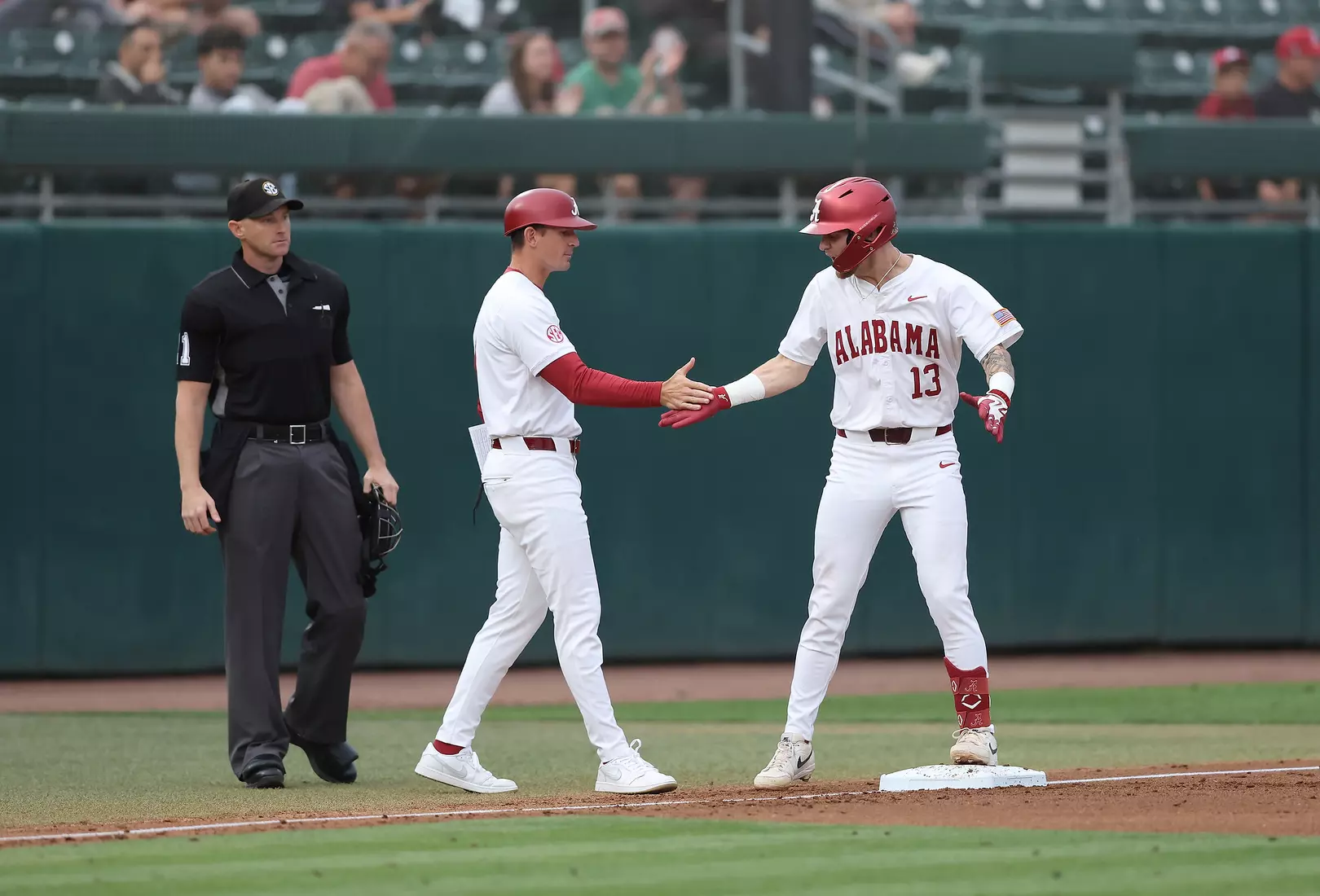 Alabama Assistant Coach Anthony Papio and player Luke Vaughn (13) icelebrate against Vanderbilt at Sewell-Thomas Stadium in Tuscaloosa, AL on Thursday, Apr 30, 2026.
