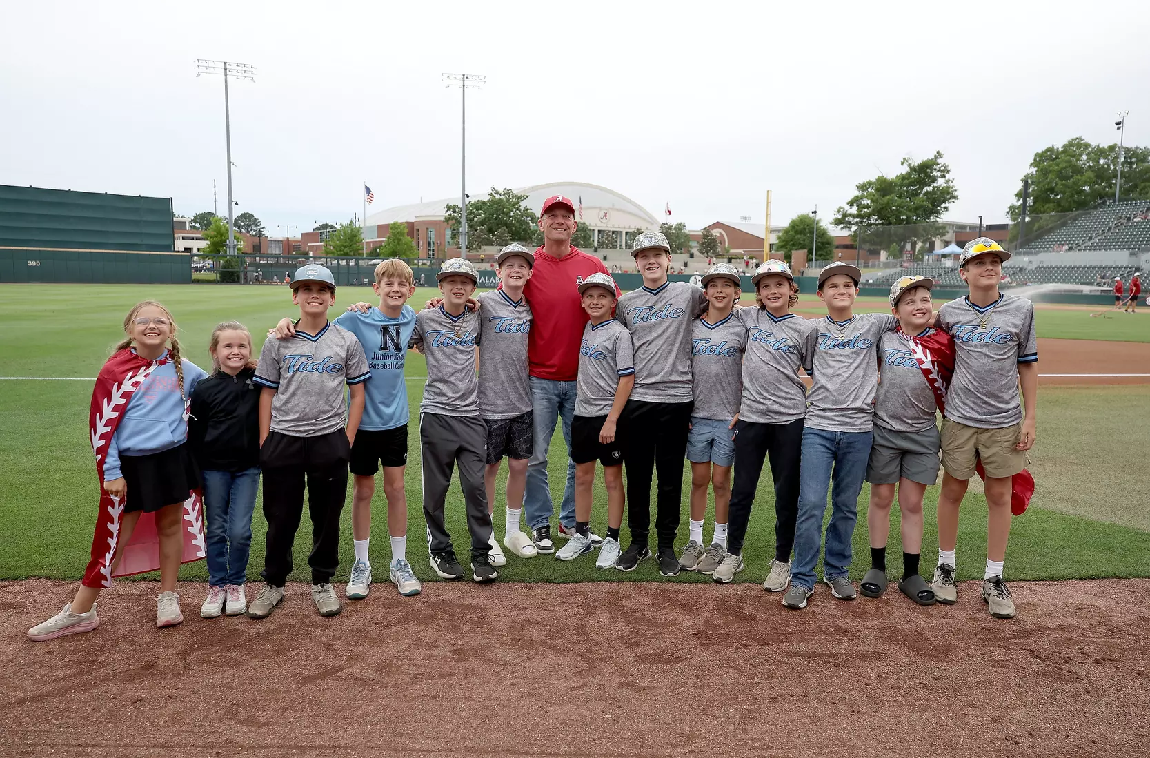 Alabama football coach Kalen DeBoer takes a picture with fans prior to throwing out the first pitch at the Vanderbilt game at Sewell-Thomas Stadium in Tuscaloosa, AL on Thursday, Apr 30, 2026.
