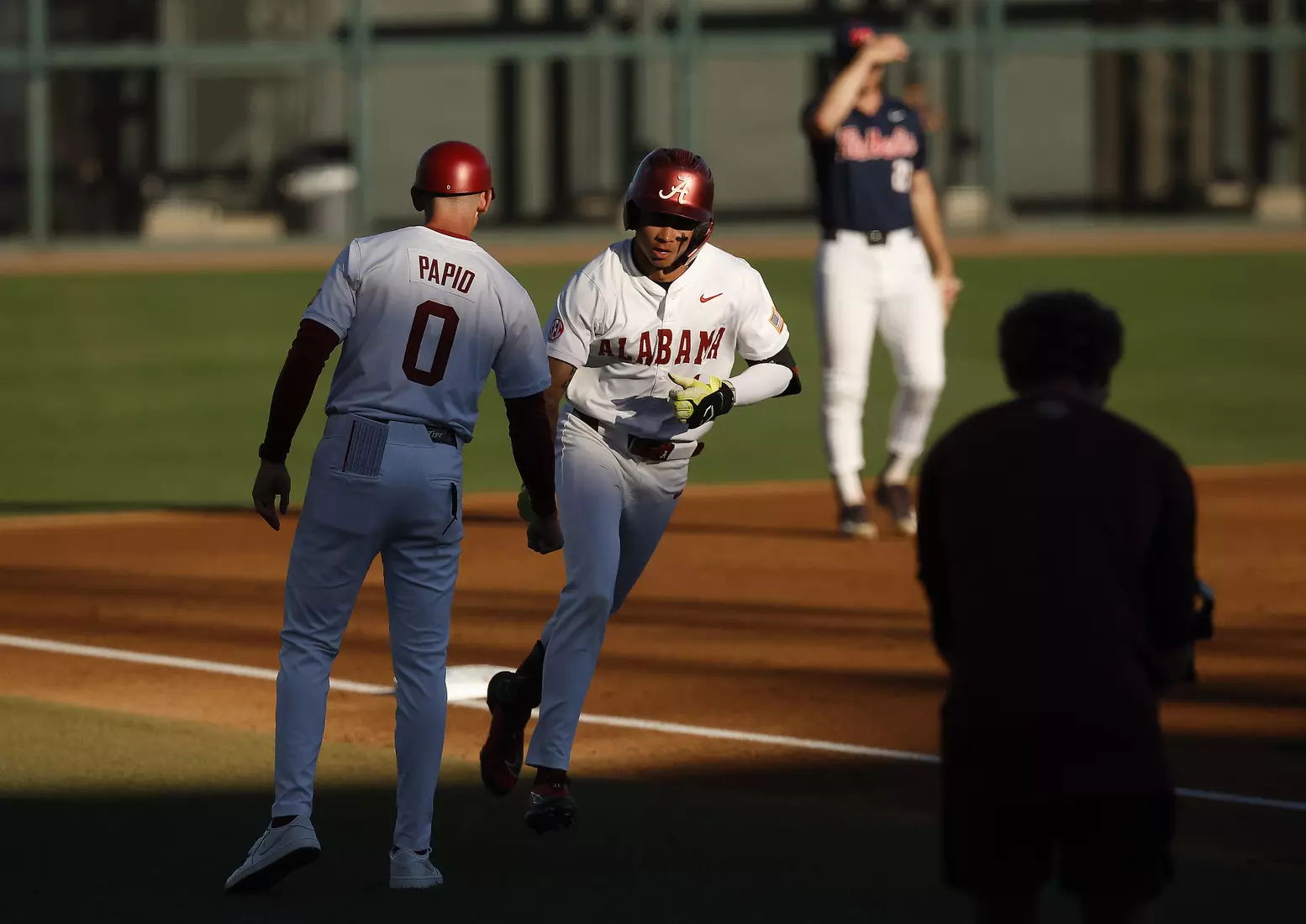Alabama Assistant Coach Anthony Papio and Alabama Baseball Player Justin Lebron (1) celebrate against Ole Miss at Sewell-Thomas Stadium in Tuscaloosa, AL on Thursday, May 14, 2026.