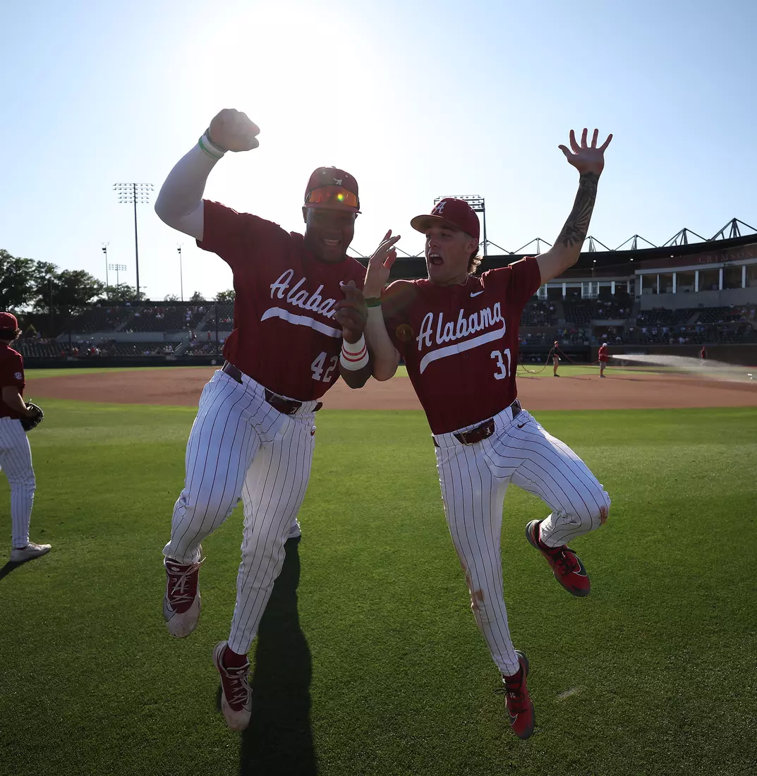 Alabama Baseball Player Eric Hines (42) and Alabama Baseball Player Jon Young Jr. (31) during pre game against Ole Miss at Sewell-Thomas Stadium in Tuscaloosa, AL on Friday, May 15, 2026.