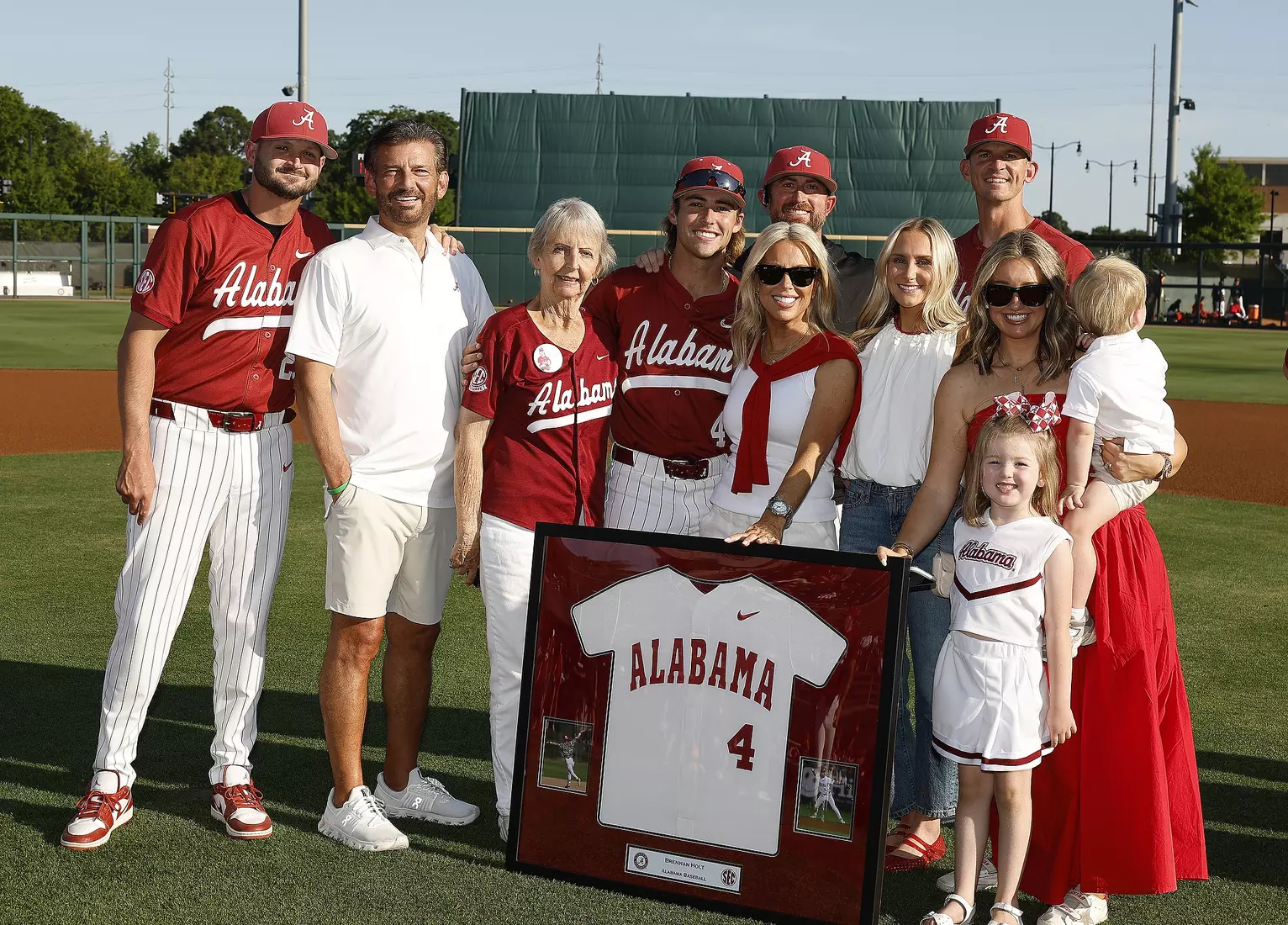Alabama Baseball Player Brennan Holt (4) celebrates Senior Day with his coaches and family prior to taking on Ole Miss at Sewell-Thomas Stadium in Tuscaloosa, AL on Friday, May 15, 2026.