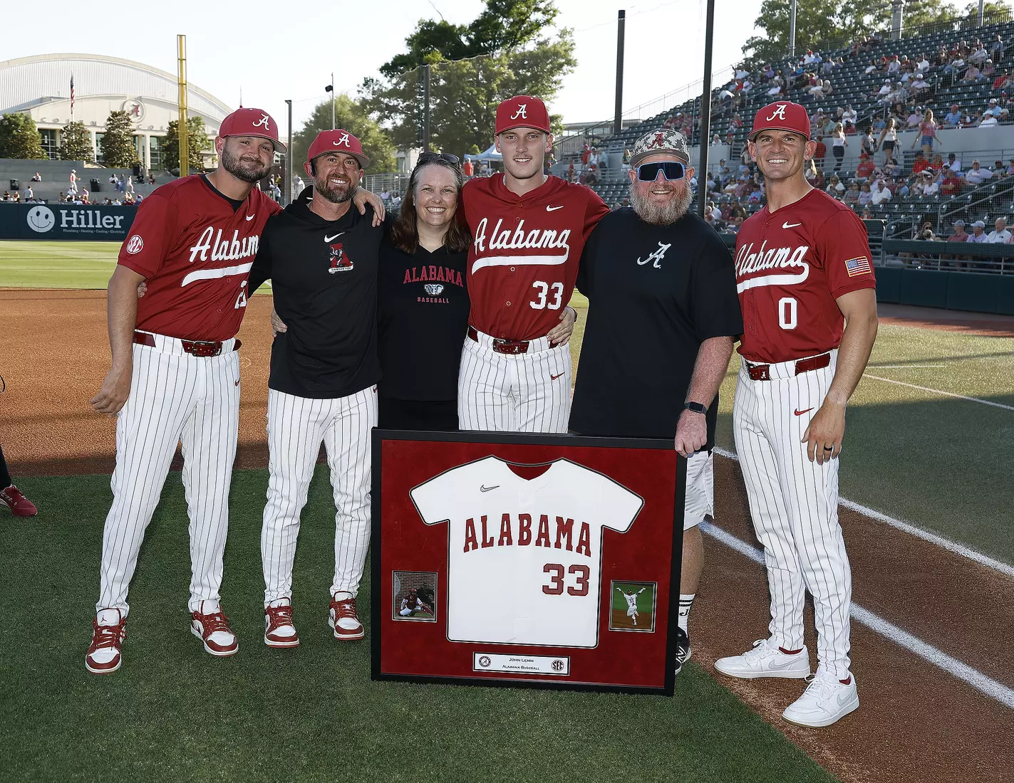 Alabama Baseball Player John Lemm (33) celebrates Senior Day with his coaches and family prior to taking on Ole Miss at Sewell-Thomas Stadium in Tuscaloosa, AL on Friday, May 15, 2026.