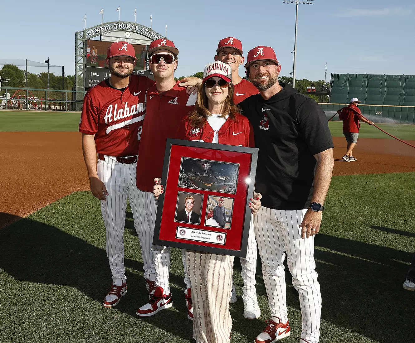 Alabama manager Zachary Phillips celebrates Senior Day with his coaches and family prior to taking on Ole Miss at Sewell-Thomas Stadium in Tuscaloosa, AL on Friday, May 15, 2026.