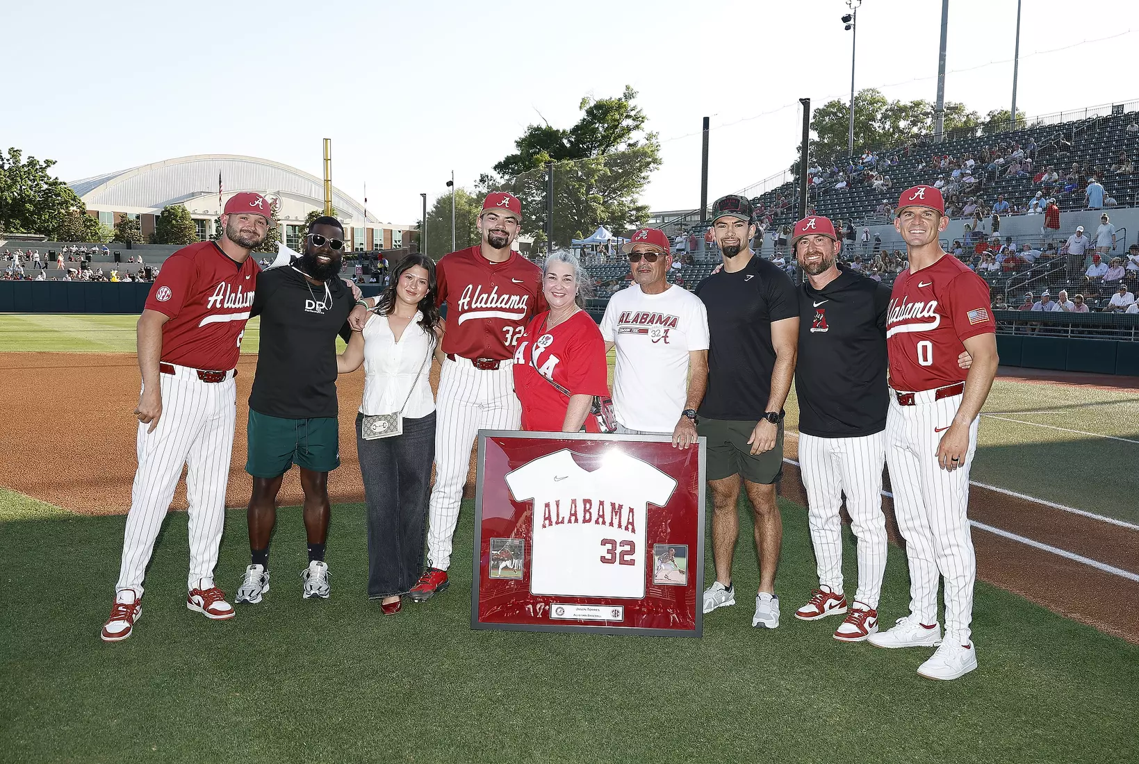 Alabama Baseball Player Jason Torres (32) celebrates Senior Day with his coaches and family prior to taking on Ole Miss at Sewell-Thomas Stadium in Tuscaloosa, AL on Friday, May 15, 2026.