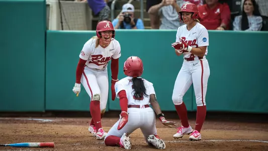 Audrey Vandagriff (12), Kristen White (3) and Salen Hawkins (47) celebrate at home after scoring vs. LSU (May 22, 2026)