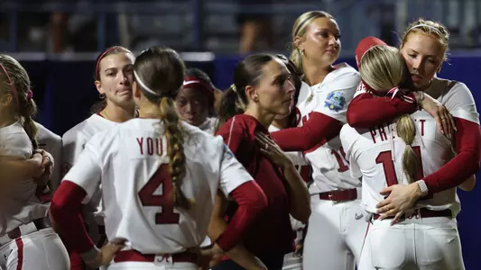 Alabama players hug after a season-ending loss to Texas Tech at the WCWS (June 1, 2026)