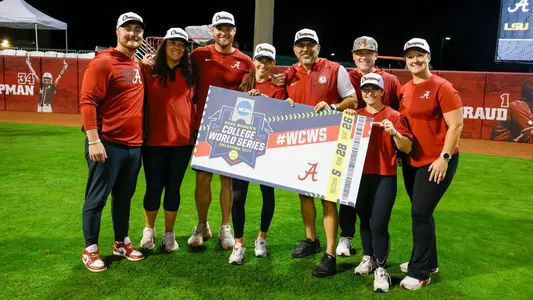 Alabama softball coaches and support staff on the field after Super Regionals (May 23, 2026)