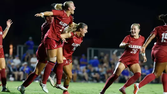 Avery Brown (3) celebrates with teammates after a game-winning goal at Memphis (Aug. 25, 2026)