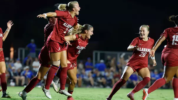 Avery Brown (3) celebrates with teammates after a game-winning goal at Memphis (Aug. 25, 2026)