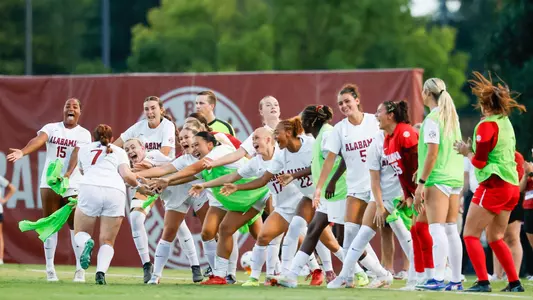 Alabama soccer players high five Larkin Thomason (7) after a goal vs. TCU (Aug. 20, 2026)