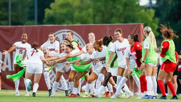 Alabama soccer players high five Larkin Thomason (7) after a goal vs. TCU (Aug. 20, 2026)