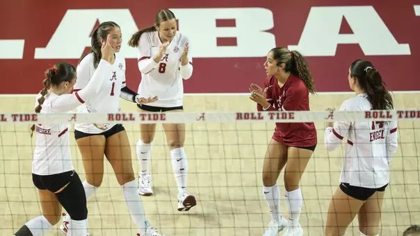 Alabama volleyball players celebrate on the court vs. Samford (Aug. 28, 2026)