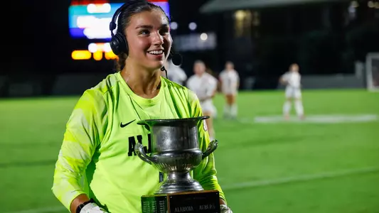 Madi Munguia (0) holds the Iron Bowl of Soccer trophy while giving a postgame interview (Sept. 14, 2026)