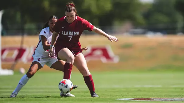 Larkin Thomason (7) dribbles past a defender vs. Oklahoma (Sept. 27, 2026)