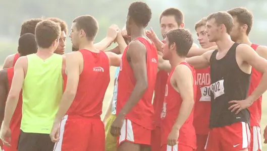 Men's cross country team huddle