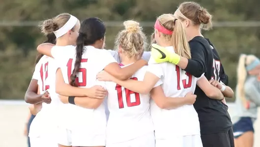 Women's soccer group huddle