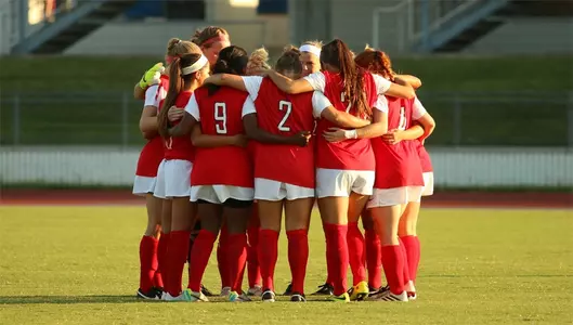 Women's soccer group huddle