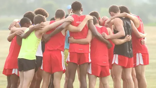 Men's cross country team huddle