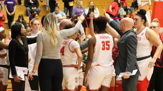 Group huddle at home opener vs. Mount St. Mary's 2019