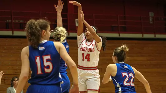 Makaila shooting the three vs American