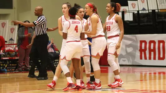Huddle after Rachel basket vs UNC Asheville