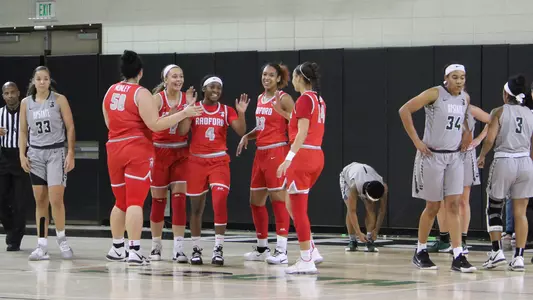 High fives after Khiana and-1 play at Upstate