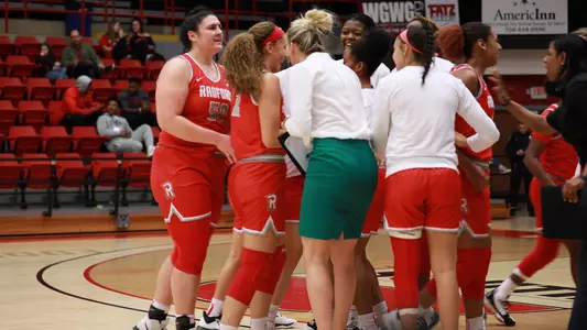 Team huddle around Tina Gardner-Webb