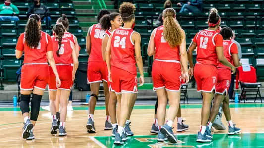 Team breaking huddle at Marshall