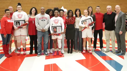 Seniors with their families and Coach McGuire