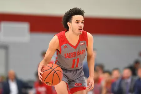 Parker's Double-Double Pushes Men's Basketball Past Hartford, 98-89 Image