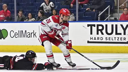 Neil Shea battles for the puck on Dec. 6, 2022 against Northeastern