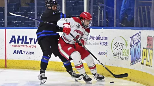 Daniel Ebrahim plays the puck in the corner