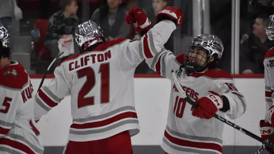 Clifton and Hanzawa celebrate the Pios' win