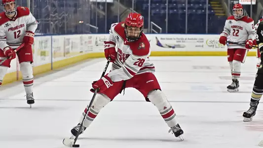 Marcus Joughin carries the puck against Army on Jan. 5, 2023