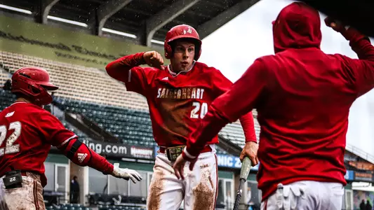 Tim McGuire celebrates a run