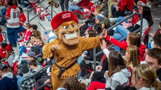 Big Red high fives a fan