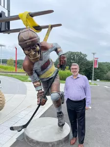 Dr. John Petillo with Big Red Hockey Statue