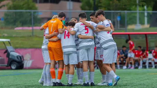 Men's soccer huddle