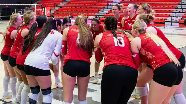 Volleyball Team Huddle Pre-Match against Quinnipiac