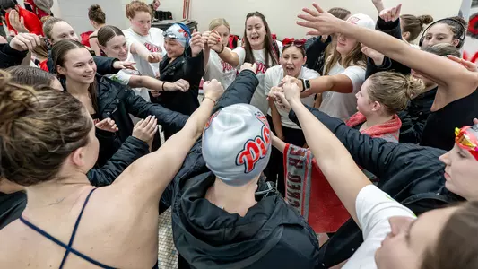 Women's Swimming & Diving Team Huddle Photo