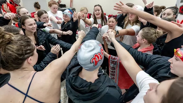 Women's Swimming & Diving Team Huddle Photo