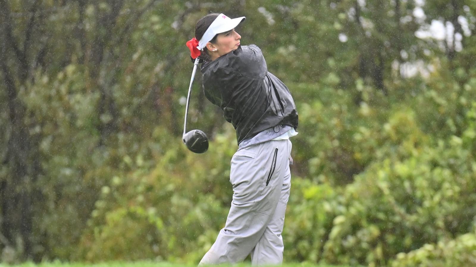 A golfer competing during the Sacred Heart Fall Classic at Great River Golf Club.