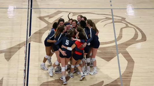 Volleyball huddle versus The Citadel