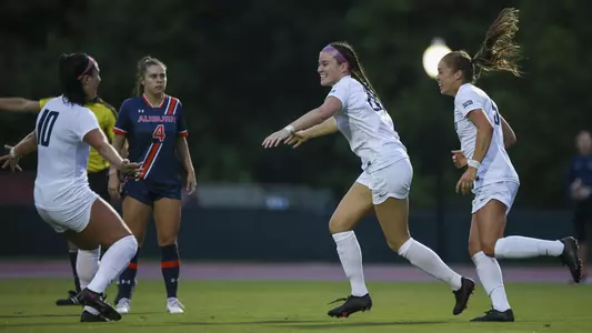 Mary Raymond celebrates after scoring