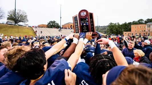 2022 football team with SoCon trophy