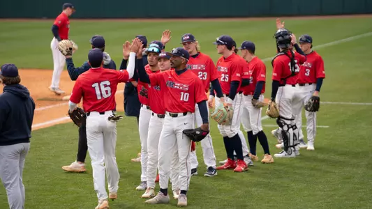 Baseball postgame high fives vs Queens