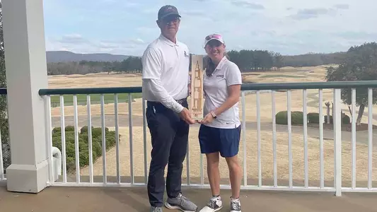 Gabi Nicastro and Coach Joe Davidson with 2025 huntsville.org Intercollegiate trophy