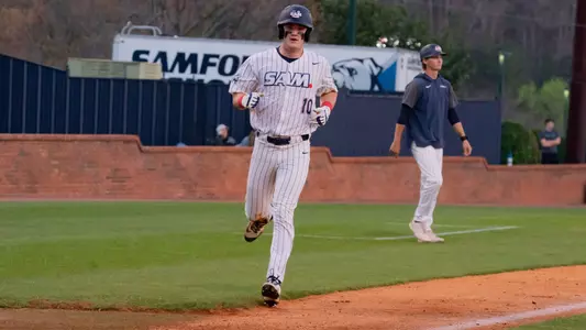 Trey Higgins scoring a run in 2025